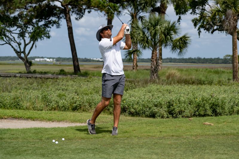 HEARTest Yard founders Greg Olsen teed off during the competition.