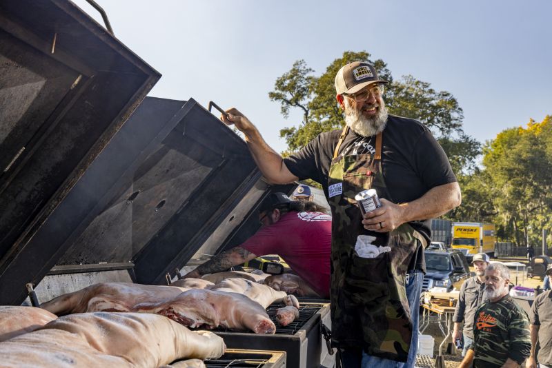 Local pitmaster and Swig &amp; Swine owner Anthony DiBernardo tends to a smoker.