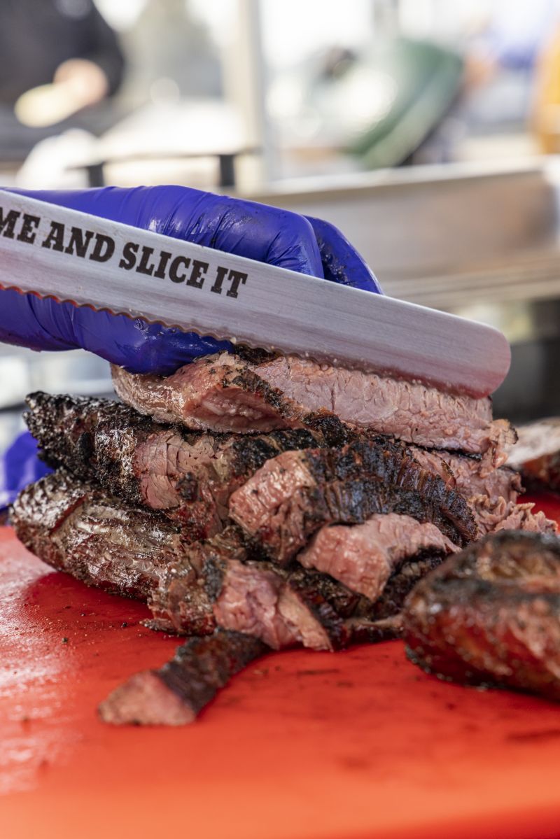 Certified Angus beef brisket being prepared in the Texas Village.