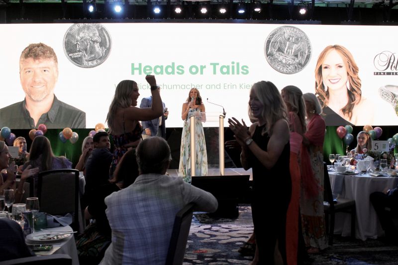 Guests played Heads or Tails with auctioneers Nick Cartter and George Lupton with John and Connor during a party at the Sweetgrass Inn.