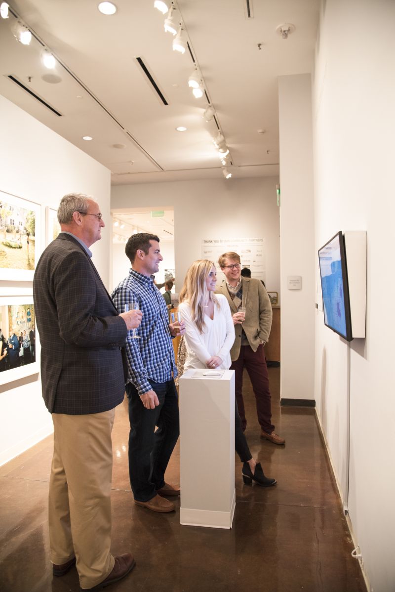 Attendees take in works in the “Southbound” exhibition.