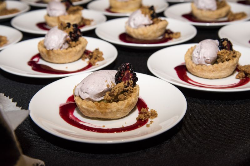 Charleston Grill&#039;s buttermilk pie with blackberry bourbon jam, blackberry whipped cream, and brown sugar streusel