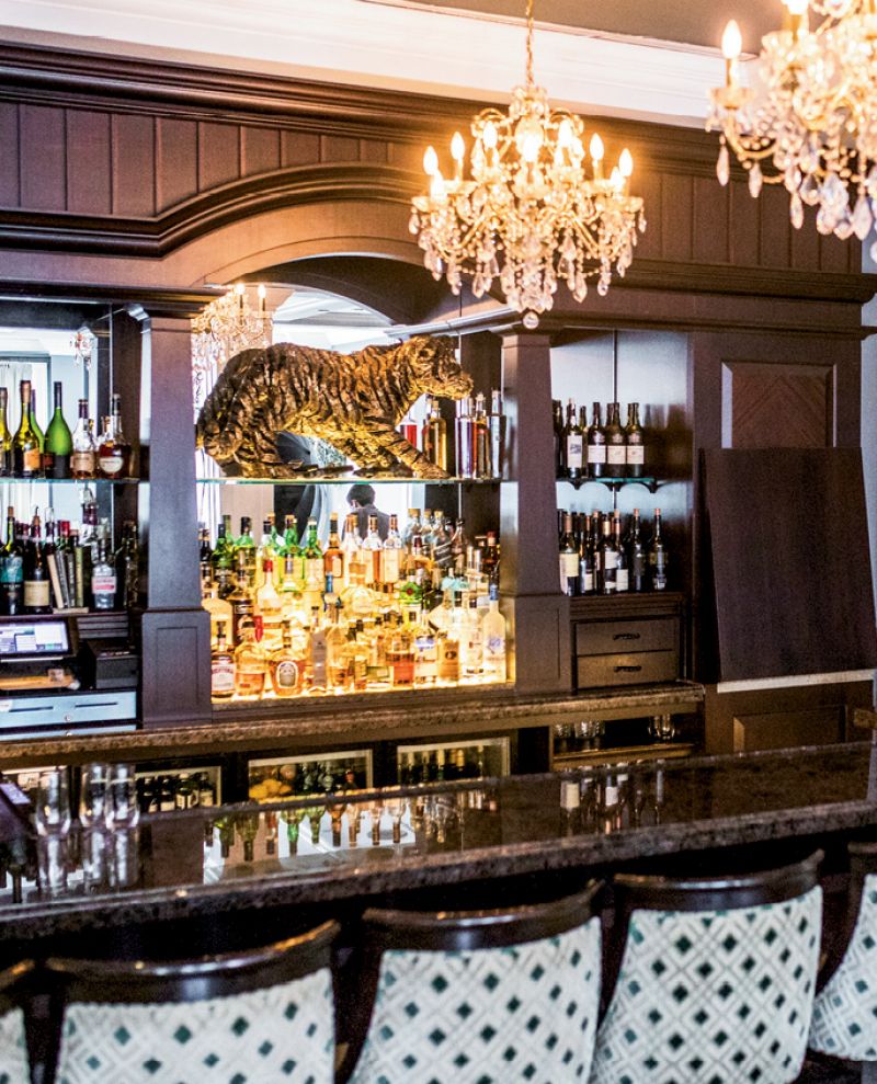 canvasses hang throughout the dining room, while a golden tiger commands attention at the bar.