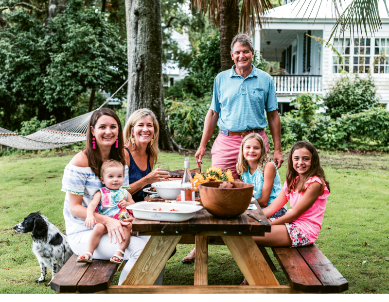Jimmy Hagood, his wife, Anne Marie, and daughters Catherine and Mary Neill (with granddaughter Louisa) gather with friends on the river.