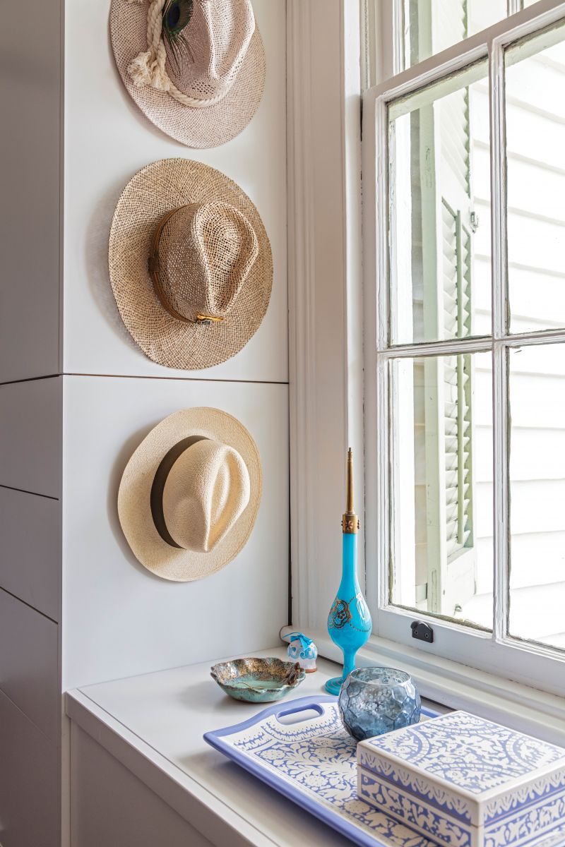 “A neighbor told us that a woman who once lived here was a hatmaker; displaying some of my collection is my ode to her,” she continues.