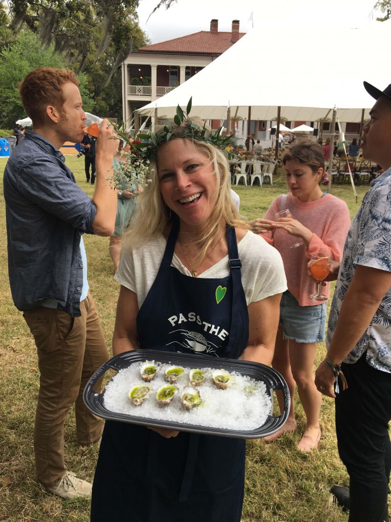 Angel Holmes passes out oysters.