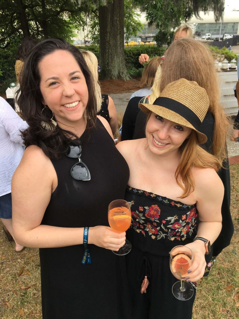 Julie Quinn and Jessica Wincott wait in line for a flower crown.