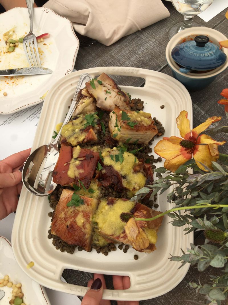 Guests passed hearty shared plates of pork belly.