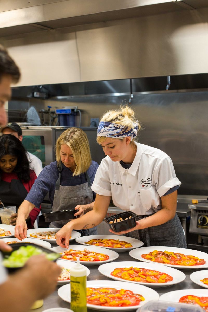 Chefs prepare the first course, a delicious Lowcountry Seafood Salad.