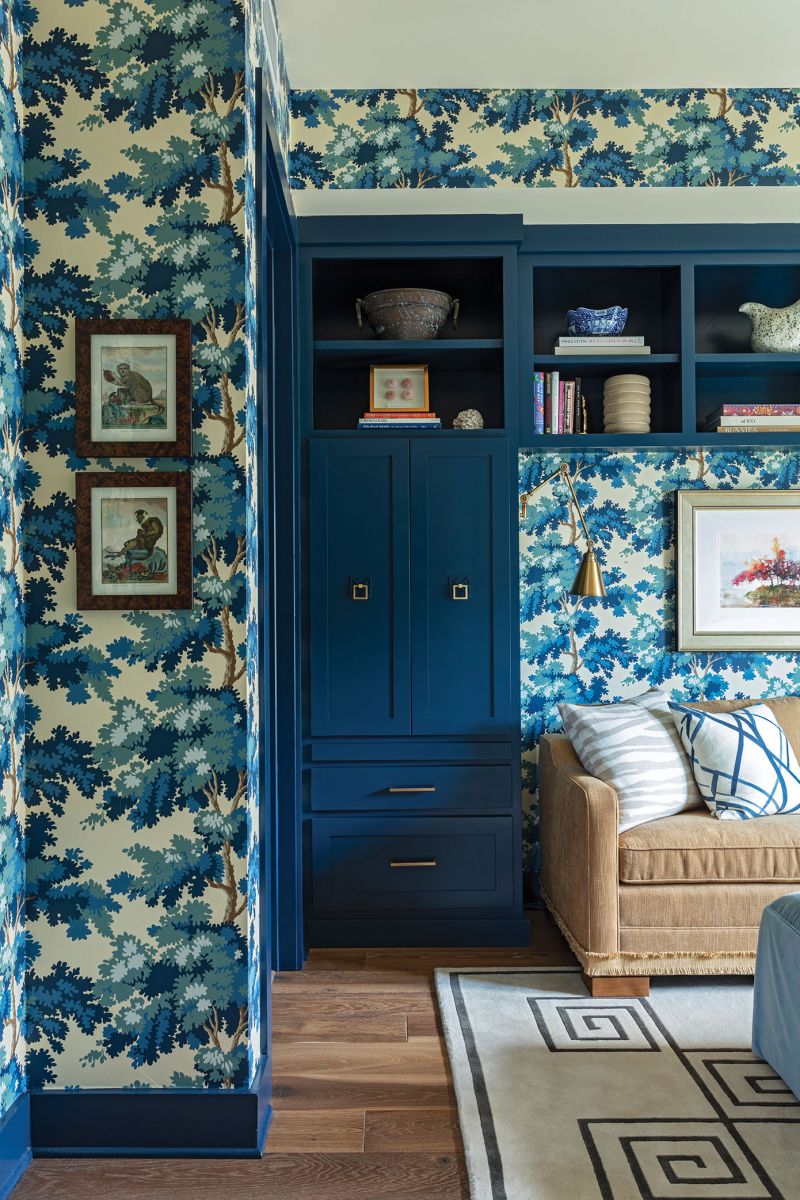 The Kravet sofa turns into a bed, and the drawers have pull-out table tops to function as nightstands when guests visit.