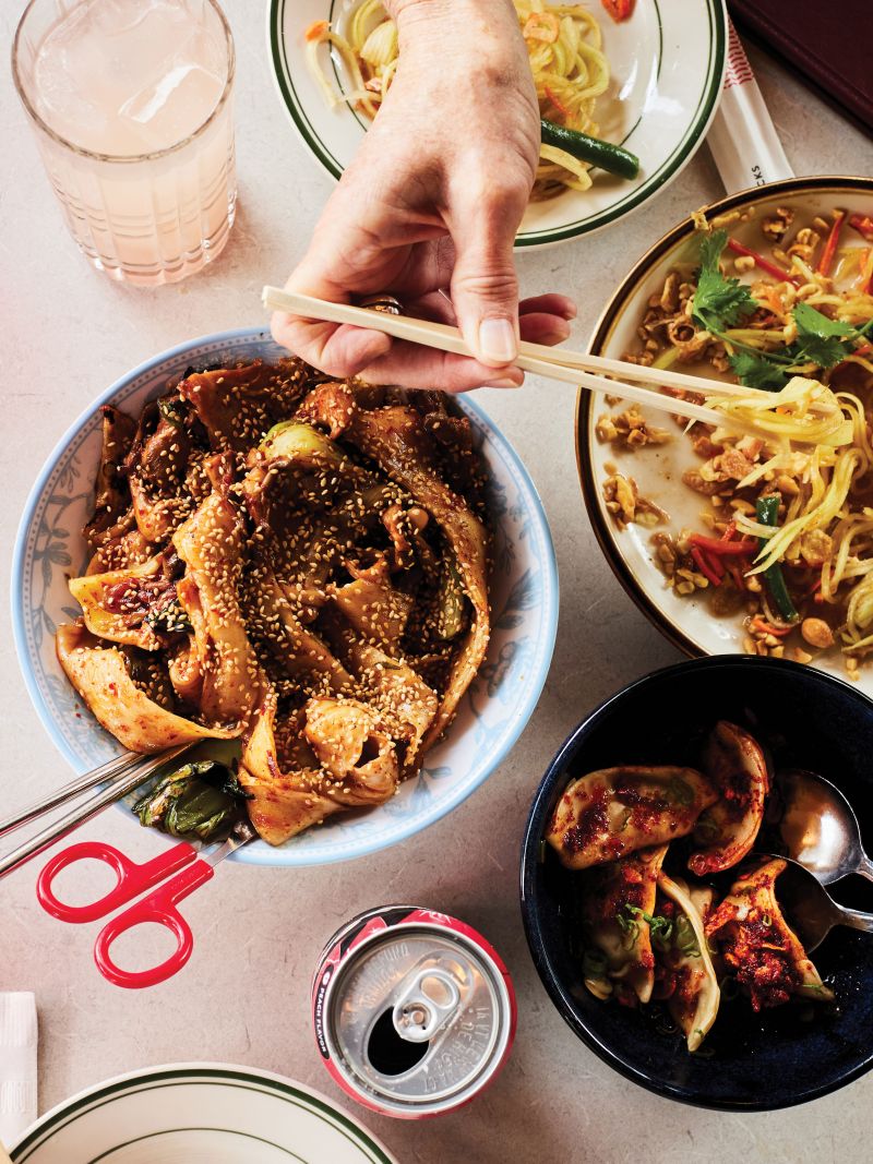 Bowls of noodles and green papaya salad at Xiao Bao in East Nashville.