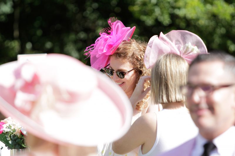 Multiple guests donned colorful, over-the-top hats.