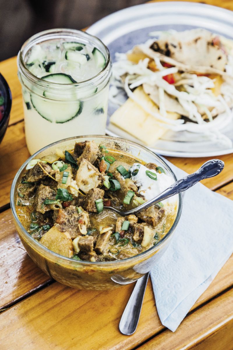Chico Feo’s West Indian-style curry goat bowl, mahi tacos on homemade corn tortillas, and a refreshing cucumber soda to wash it down