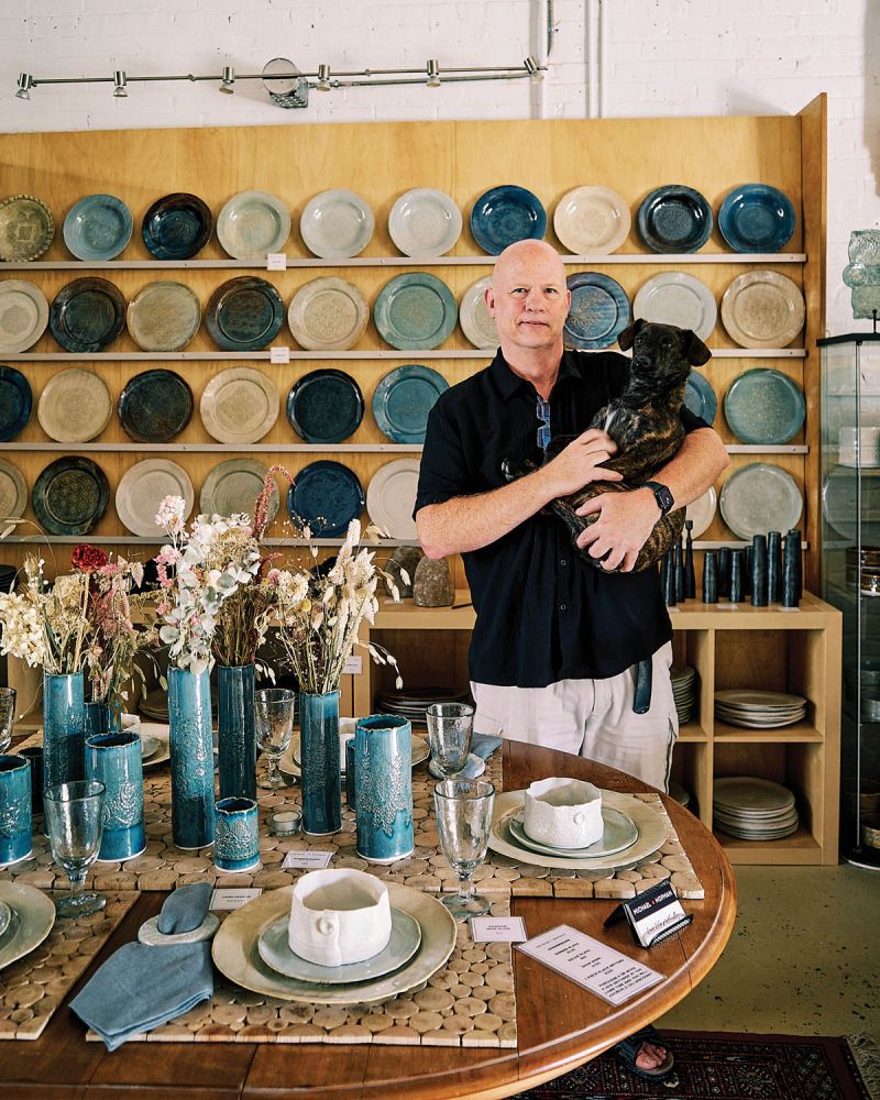 Michael Hofman and his porcelain pieces (plus dog, Vinnie) at Hofman Studios in the River Arts District