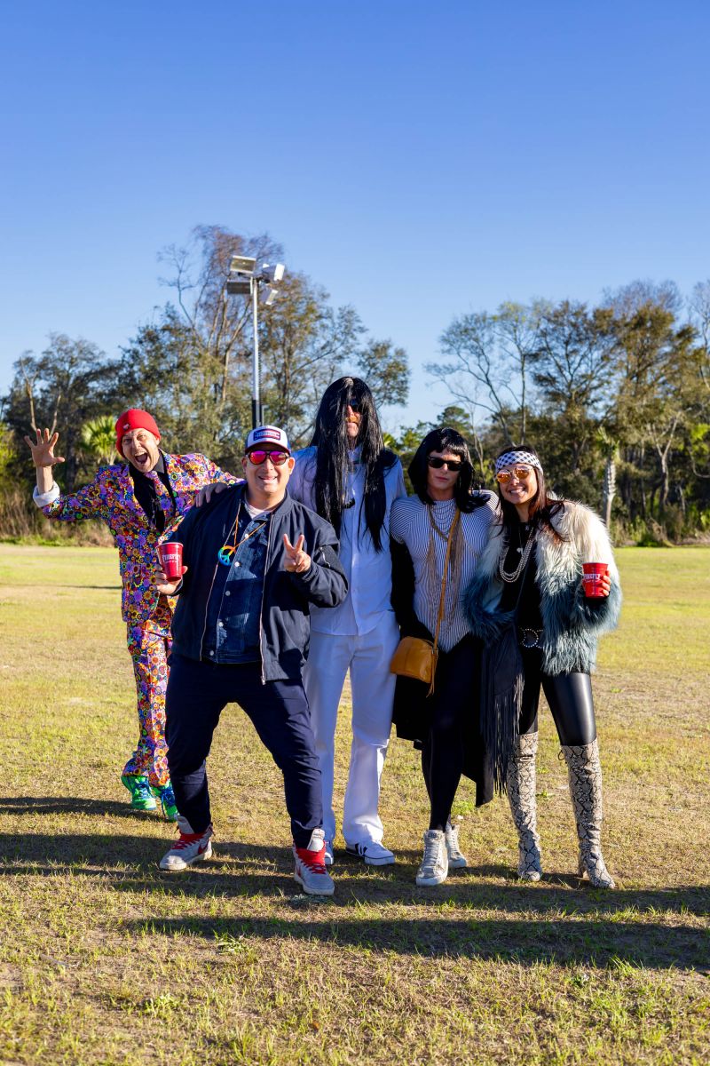 Host Ryan Becknell photobombed guests Gustavo Serrano, Mike VanMyer and Brianna Stello, and event DJ Andrea Serrano.