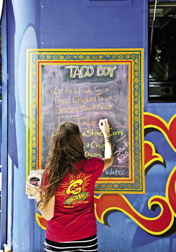 Parades writes out the day’s menu